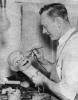 Frank Marshall painting a ventriloquist dummy head